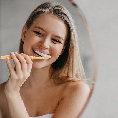 Woman brushing her teeth