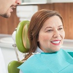 Woman smiling in the dental chair