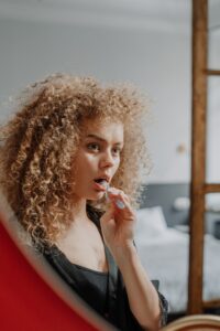 Concerned woman brushing her teeth